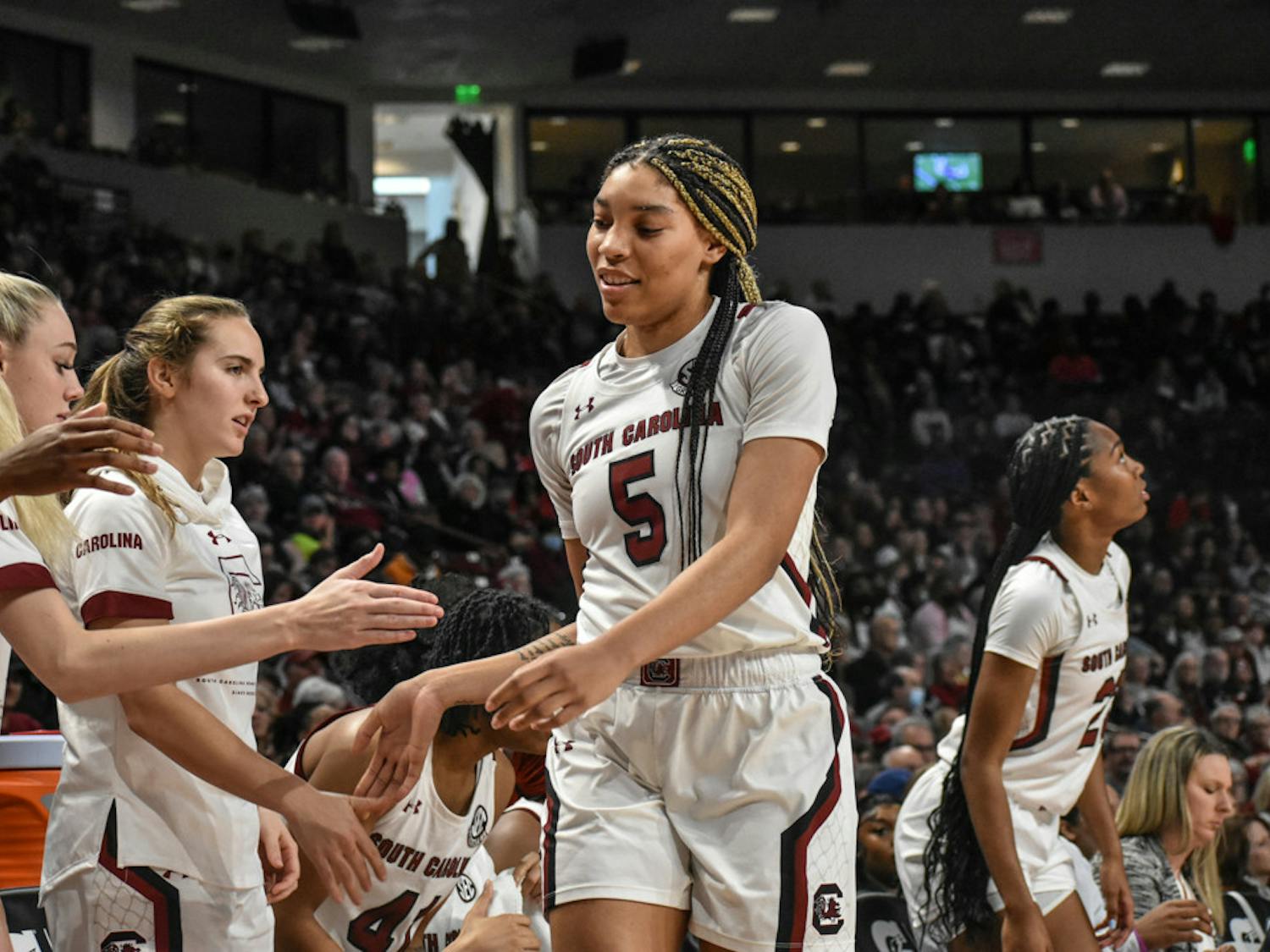 FILE—Senior forward Victoria Saxton high-fives her teammates before taking the bench. Saxton led the team in points, 19, in its SEC tournament game against Arkansas on Friday.