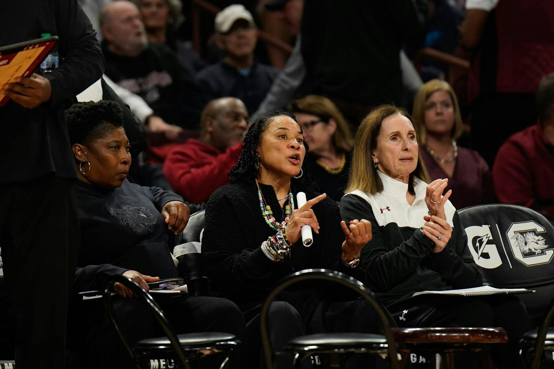 Head coach Dawn Staley and assistant coaches Mary Wooley and Jolette Law on the bench during the halftime shootaround before the start of the second half against Grand Canyon University at Colonial Life Arena on Nov. 3, 2025. The Gamecocks won this game 94-54.