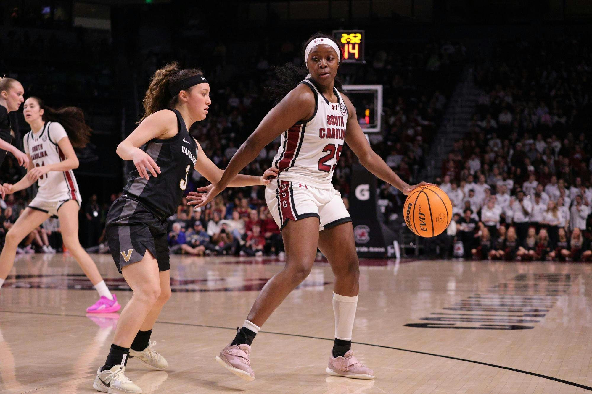 Senior guard Raven Johnson dribbles against a Vanderbilt defender during the Gamecocks’ matchup at Colonial Life Arena on Jan. 25. She looks for space to set up the next play as her teammates move around her.