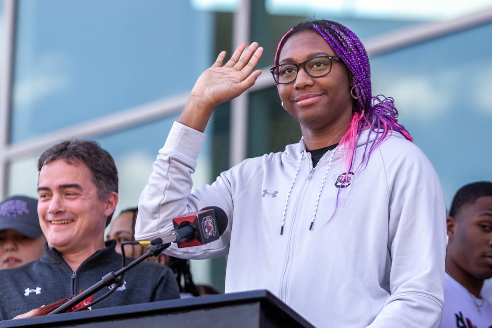 Junior forward Aliyah Boston waves to the crowd at Colonial Life Arena on April 4, 2022. Many South Carolina fans gathered at the arena to welcome the Gamecocks back to Columbia. 