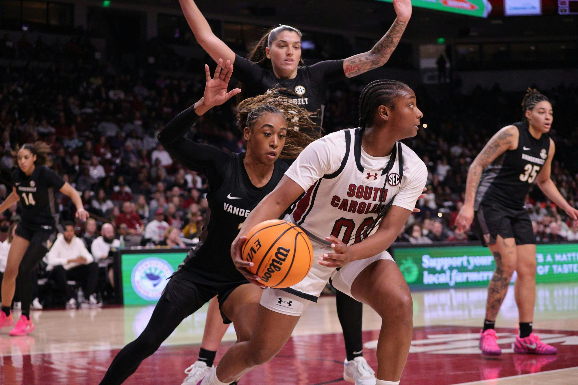 FILE — Senior guard Ta'Niya Latson holds the ball during the Gamecocks’ matchup with Vanderbilt at Colonial Life Arena on Jan. 25. She looks for room to move while defenders close in around her.