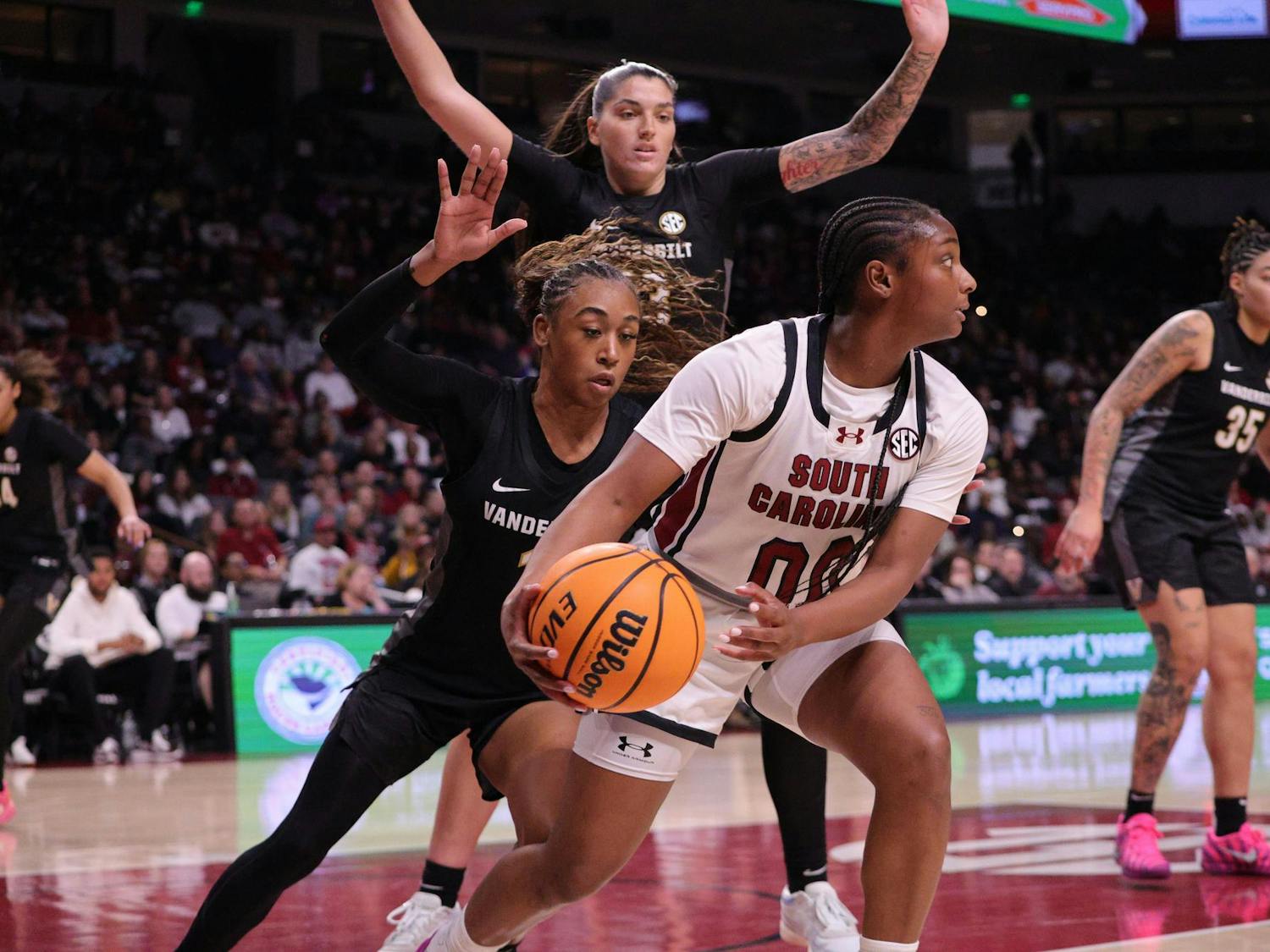 FILE — Senior guard Ta'Niya Latson holds the ball during the Gamecocks’ matchup with Vanderbilt at Colonial Life Arena on Jan. 25. She looks for room to move while defenders close in around her.