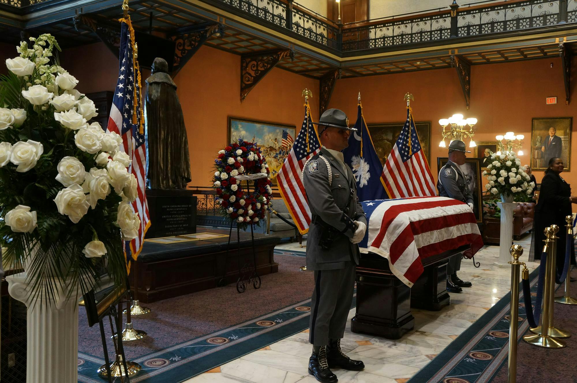 South Carolina Highway Patrol officers stand guard on either side of Rev. Jackson Sr.’s casket. Flags, wreaths and photographs surround the memorial in order to honor the late reverend.