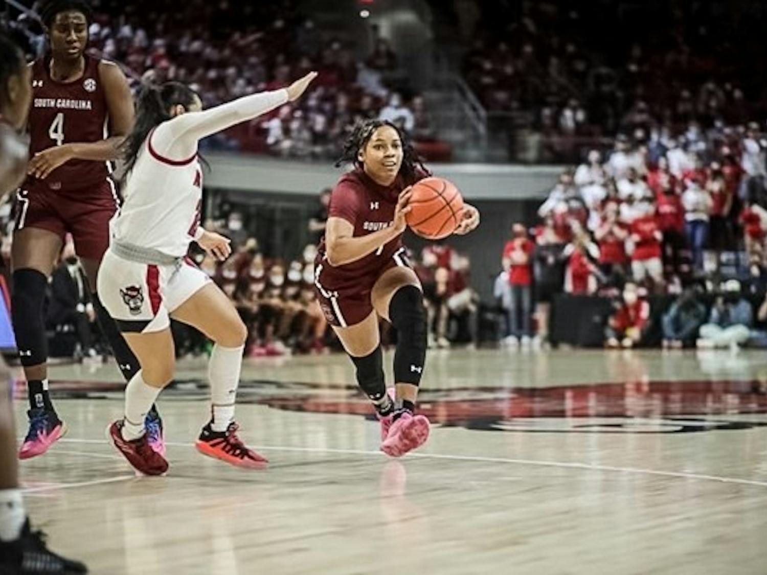 Junior guard Zia Cooke taking the ball down the court. Cooke scored 17 points against NC State on Nov. 9, 2021.