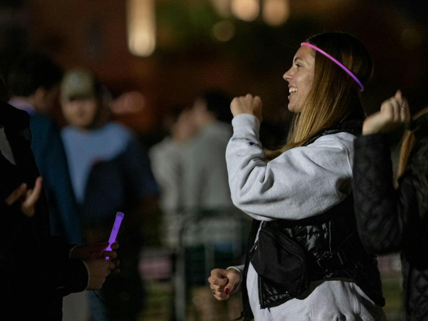 Fourth-year public health student Ameila Heipler dances to Christmas music following Tiger Burn on Nov. 20, 2023. Music was played throughout the event by DJ Zay Pola, a USC alumnus.