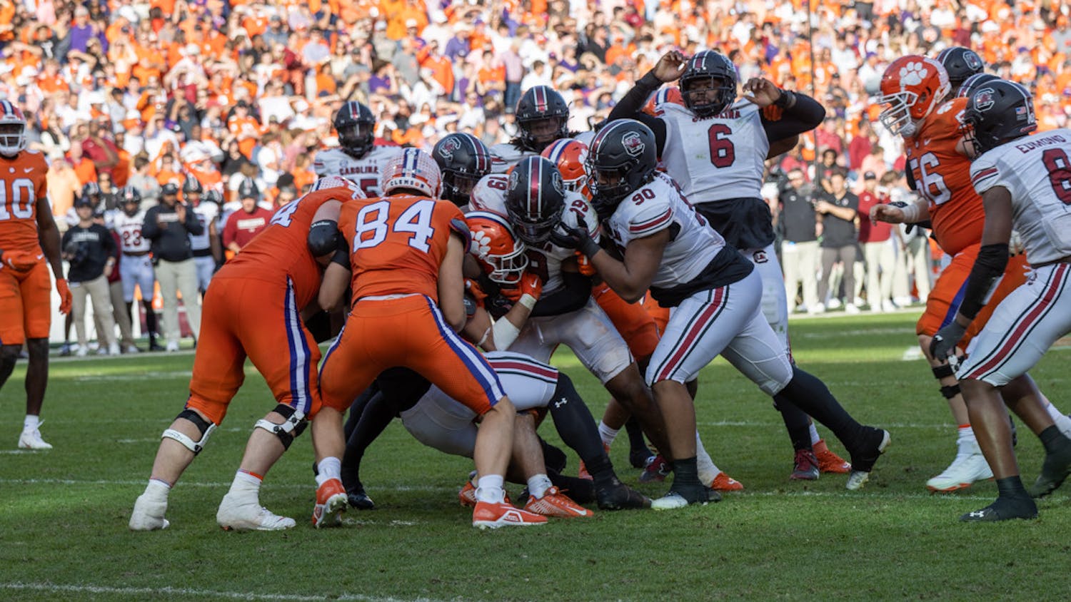 The South Carolina defensive line attempts to stop the Clemson offense during the 119th Palmetto Bowl on Nov. 26, 2022, at Memorial Stadium. The Gamecocks made 48 tackles in its 31-30 victory over the Tigers.