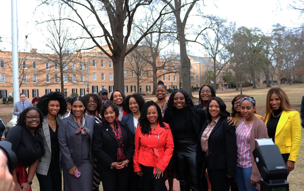 <p>The women of The Backbone pose on the Horseshoe. Eighteen women featured in the documentary were honored with bricks that were unveiled at a ceremony that followed a private screening of the film on campus. &nbsp;</p>