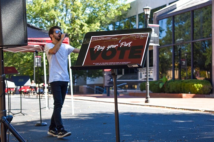 Lead singer of Room XII Mike Stearns performs in front of Russell House on Greene street as part of the Play Your Part campaign. Play Your Part is encouraging people to register and vote in the upcoming election.