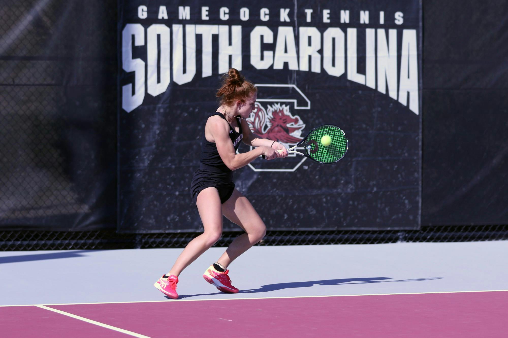South Carolina's junior Megan Davies hits a backhand to her opponent during the match against Clemson. Overall, the Gamecocks defeated Clemson 6-1.