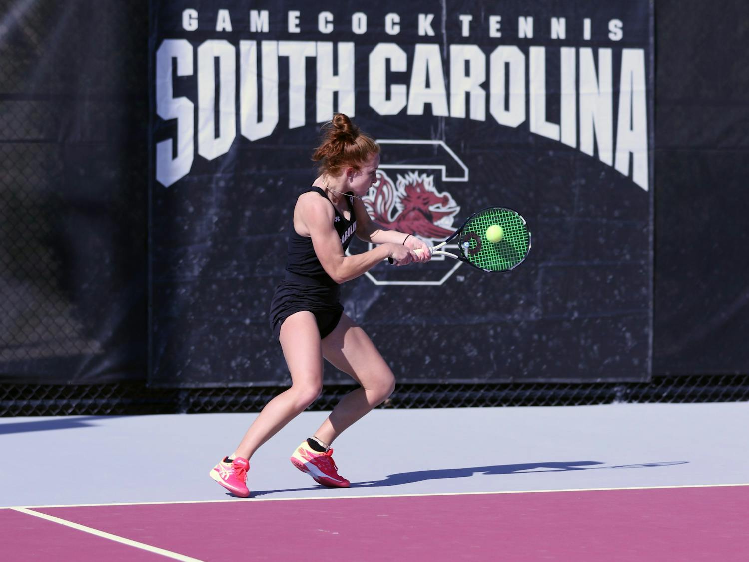 South Carolina's junior Megan Davies hits a backhand to her opponent during the match against Clemson. Overall, the Gamecocks defeated Clemson 6-1.