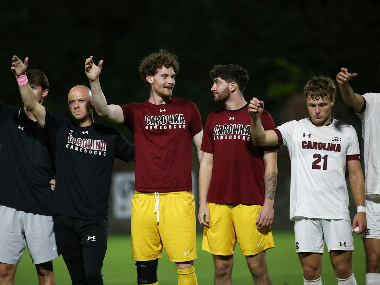 Redshirt senior goalkeeper Brant Zulauf and redshirt freshman goalkeeper Matt Bender sing the alma mater with their teammates after the team's game against Jacksonville University on Oct. 3, 2023. The Gamecocks defeated the Dolphins 1-0.&nbsp;