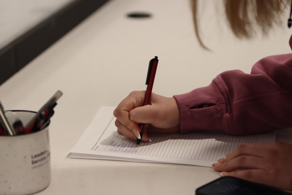 <p>A student senate candidate signs in before an information session held in Russell House on Feb. 6, 2024. Candidates were allowed to begin their campaigns as early as the conclusion of the mandatory meeting.</p>