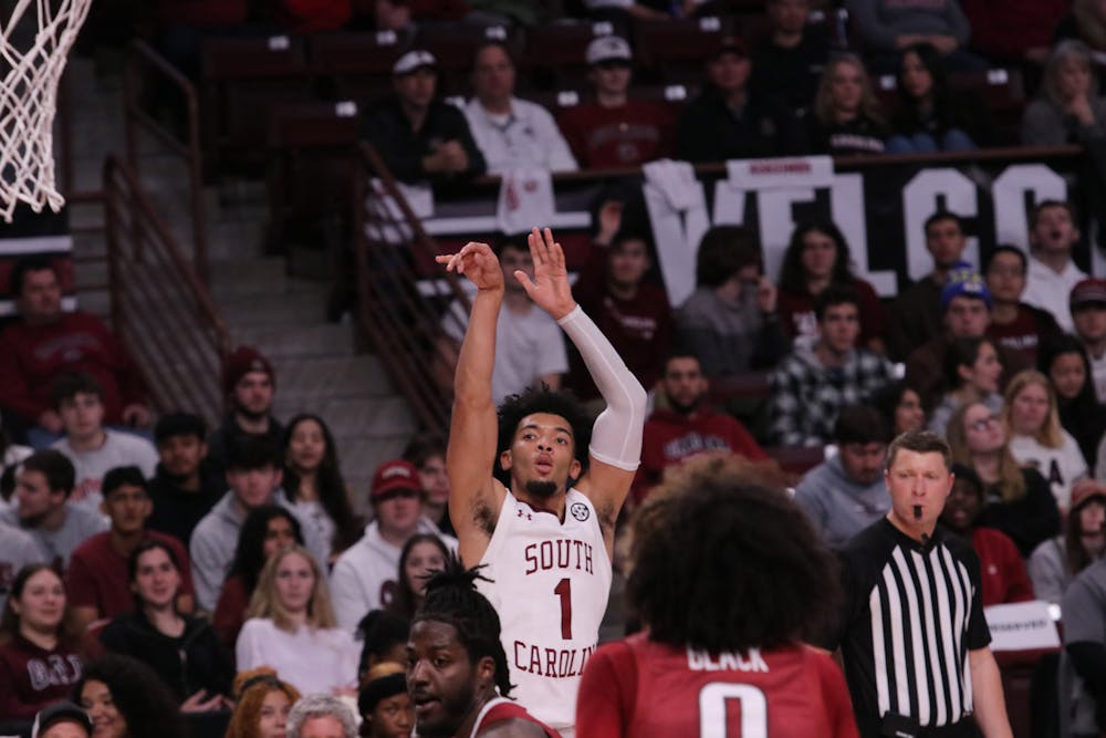 <p>FILE—Sophomore guard Jacobi Wright shoots for a three-pointer against Arkansas' defense at Colonial Life Arena on Feb. 4, 2023. Wright scored 4 points in 27 minutes, but it was not enough to help the Gamecocks defeat the Razorbacks. &nbsp;</p>