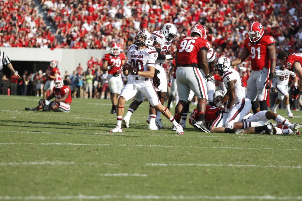 	Gamecocks corner back Sidney Rhodes celebrates after Georgia was unable to get the punt off on fourth down.