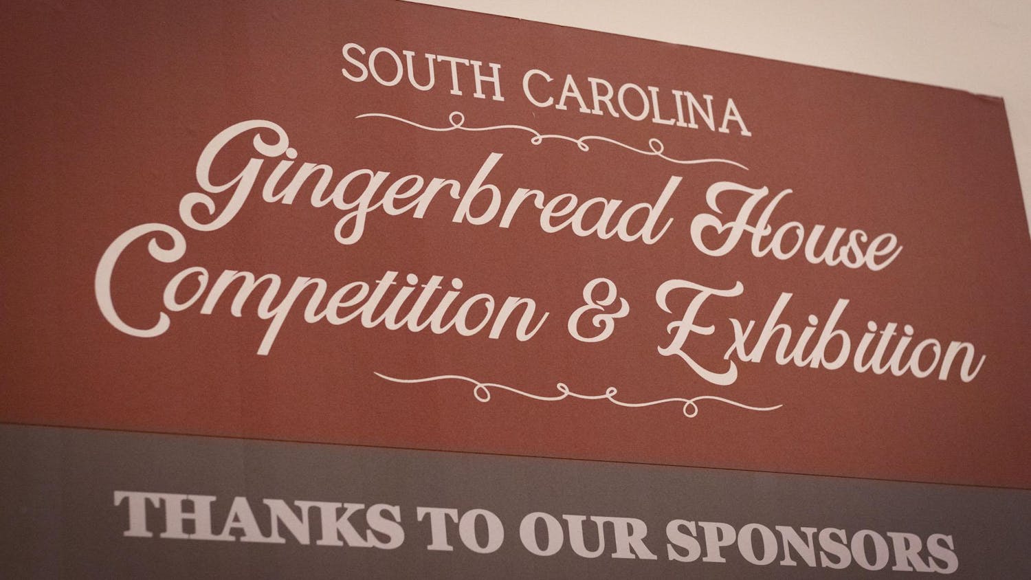 A sign for the first annual Gingerbread Contest and Exhibition presented by NoMa Warehouse and Davis Architecture. All of the proceeds made by the event were awarded to Rapid Shelter Columbia.