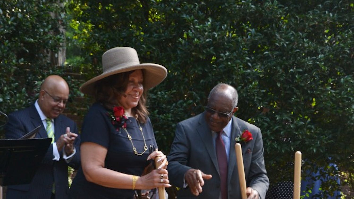 	Henrie Monteith Treadwell and James Solomon Jr. turn over the dirt at the site of the future desegregation reflection garden, leaving a shovel stationary in remembrance of Robert Anderson, who, with Treadwell and Solomon, desegregated the university in 1963.