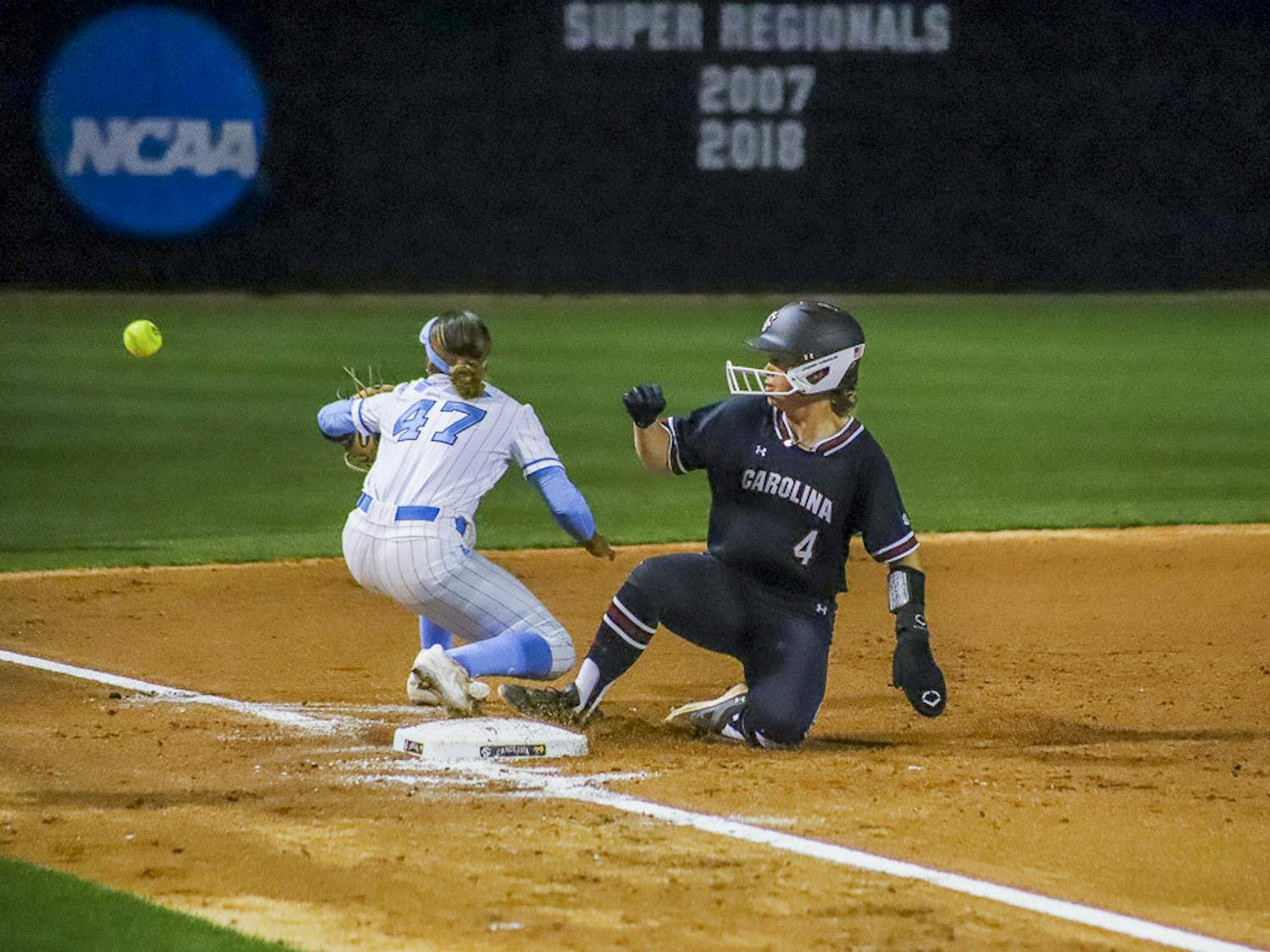 Sophomore infielder Brooke Blankenship slides feet first into third base, beating a throw during the matchup against North Carolina at Beckham Field on March 1, 2023. The Gamecocks run ruled the Tar Heels, securing a 9-1 win in six innings.&nbsp;