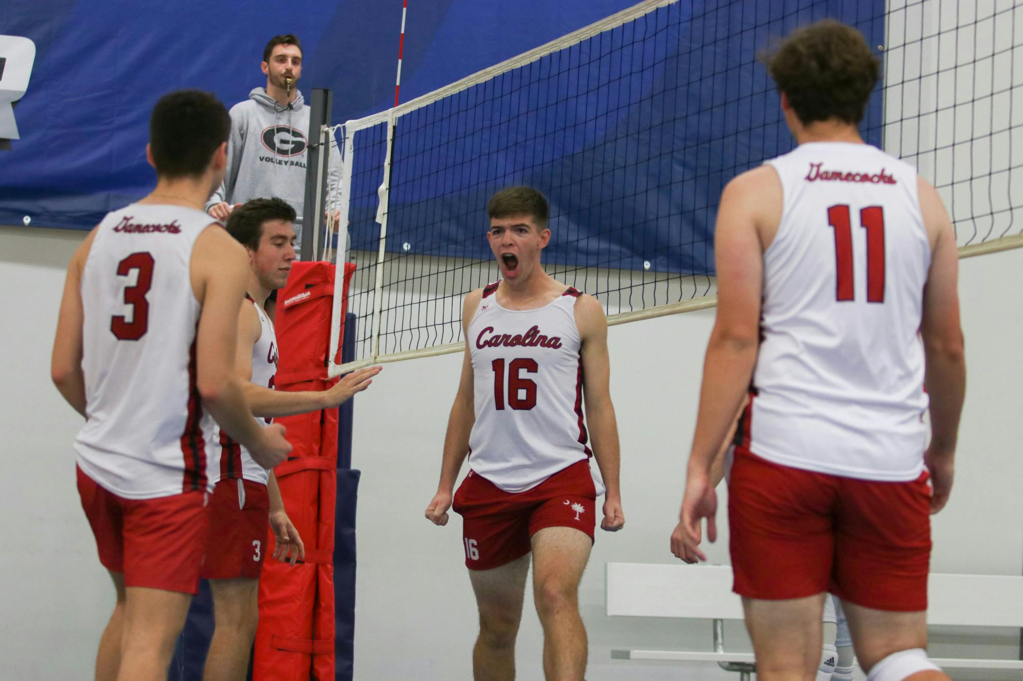 Senior middle Mason Dunaway yells out in celebration after a block in pool play for team Black. This match against UNCC B was a big win for the squad, as they swept in both sets.&nbsp;