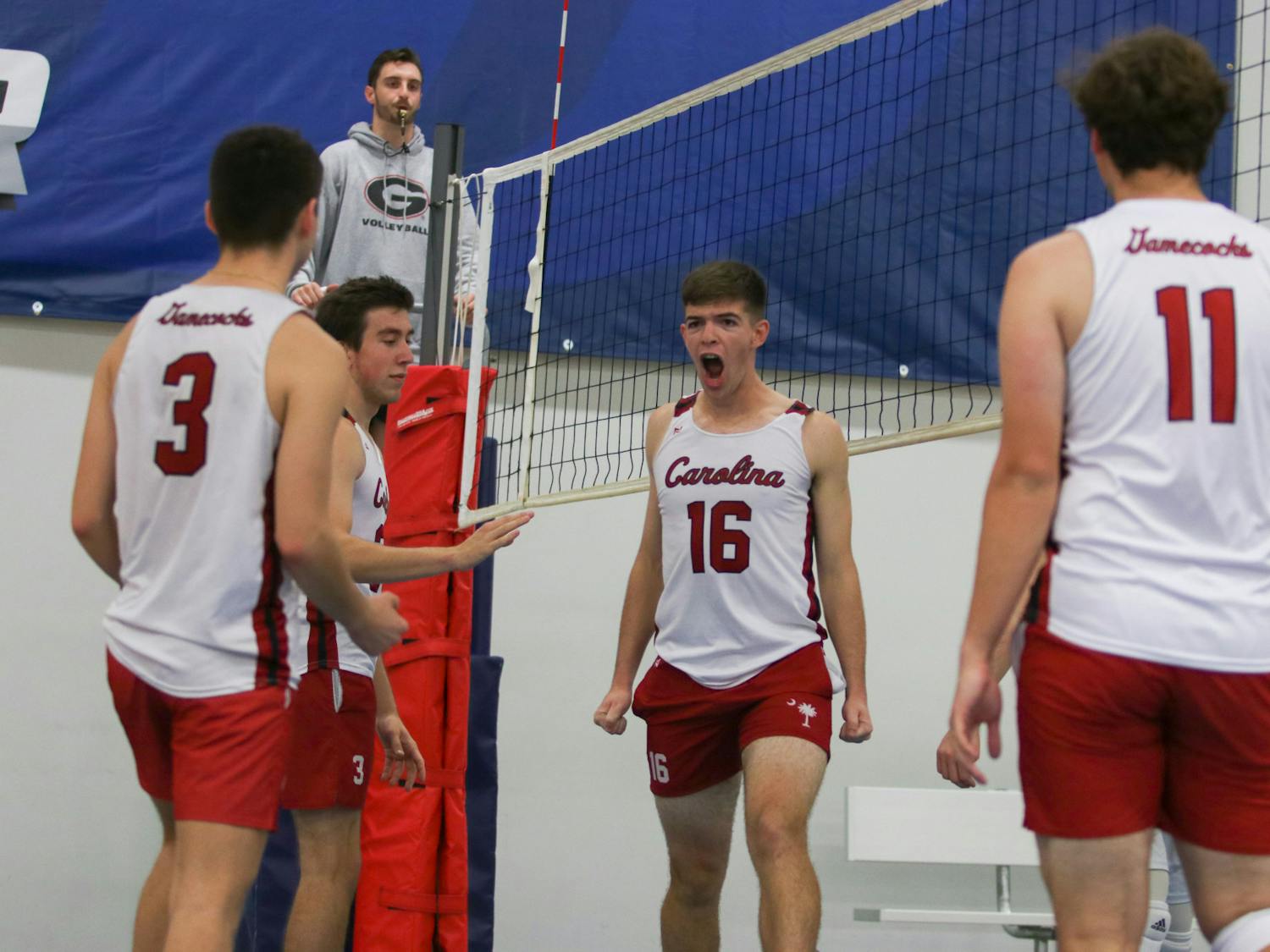 Senior middle Mason Dunaway yells out in celebration after a block in pool play for team Black. This match against UNCC B was a big win for the squad, as they swept in both sets. 