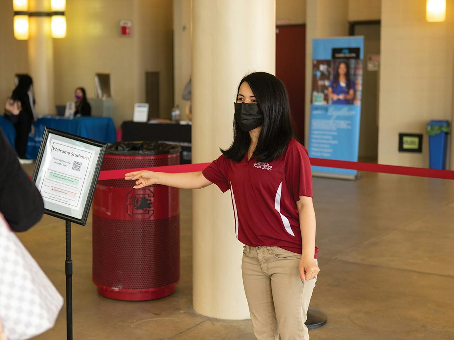 Ph.D. student Zo Sediqi directs students during the Health and Wellness job fair hosted by the USC Career Center on Feb. 2, 2022.