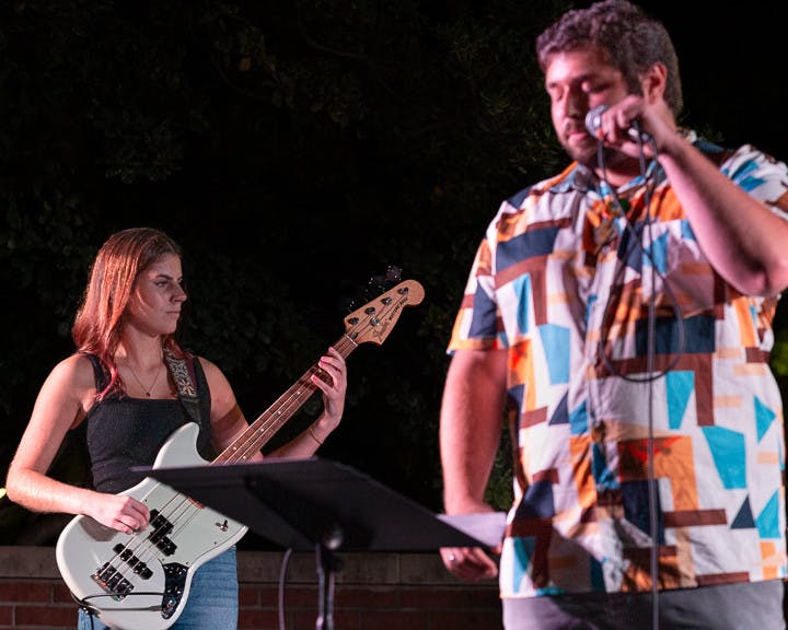 The House Band's bassist, fourth-year mathematics student Madison Adams (left), and lead singer, third-year international business and finance student Tyler Bomse (on right) perform at the battle of the bands on Oct. 5, 2022. The House Band won the competition and will be performing at the UofSC Homecoming Block Party on Oct. 5, 2022.