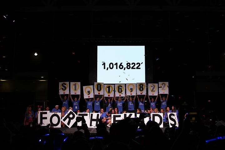 &nbsp;Volunteers cheer and laugh while on stage presenting the amount of money that the organizations of South Carolina raised for Dance Marathon.&nbsp;