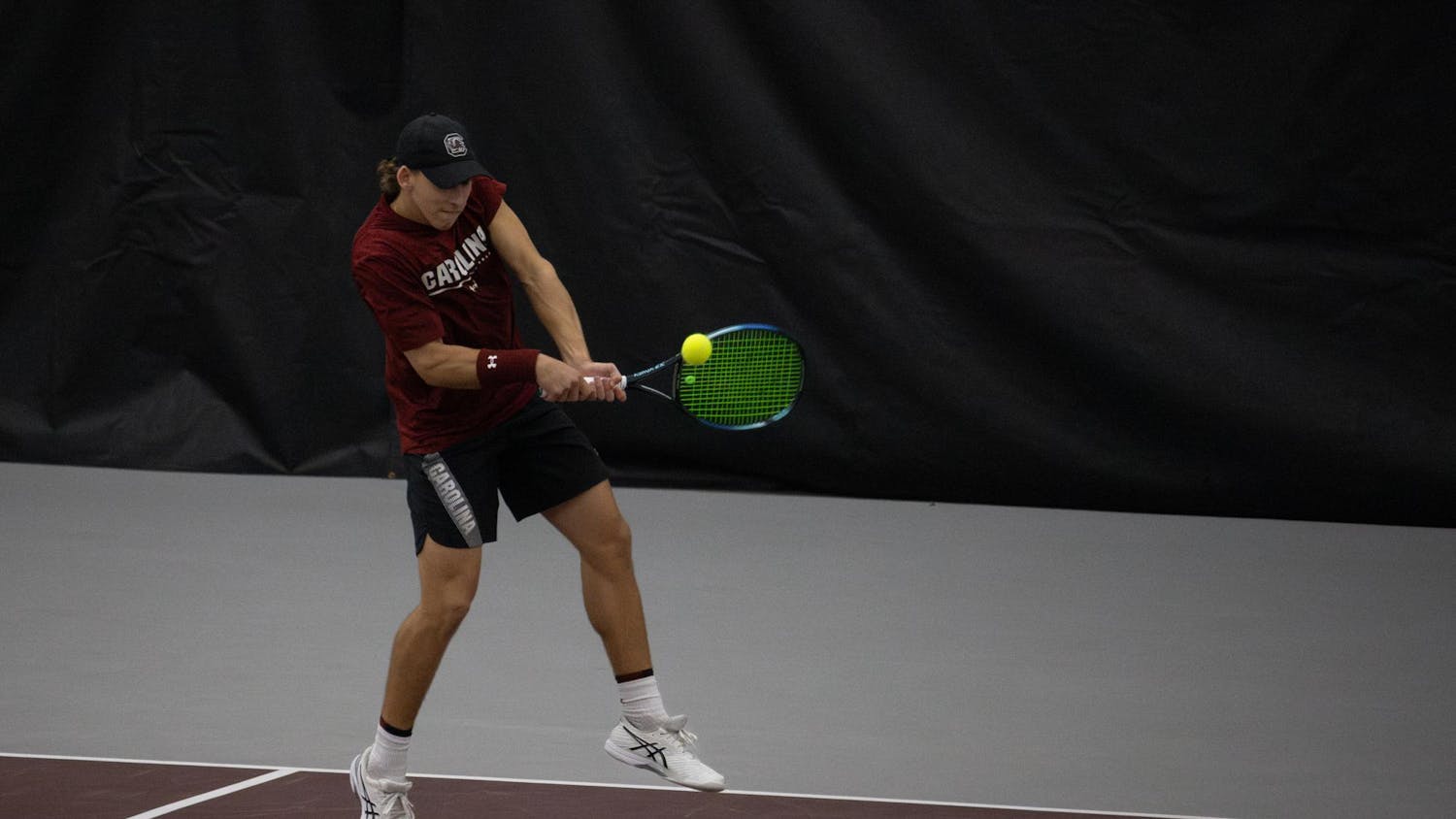 Junior Casey Hoole backhands the ball during South Carolina’s match against Clemson at the Carolina Indoor Tennis Center on Jan. 27, 2024. The Gamecocks beat the Tigers 4-2 in the rivalry matchup.