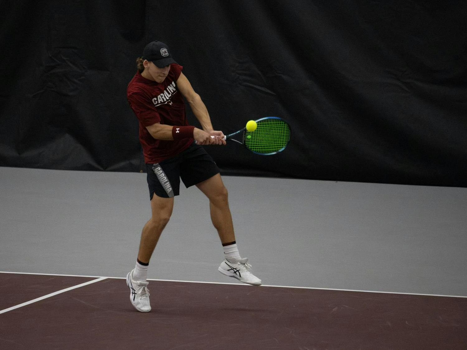 Junior Casey Hoole backhands the ball during South Carolina’s match against Clemson at the Carolina Indoor Tennis Center on Jan. 27, 2024. The Gamecocks beat the Tigers 4-2 in the rivalry matchup.