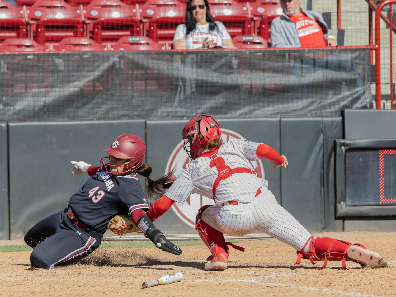 Redshirt junior utility player Quincee Lilio slides into home plate in an attempt to score for the University of South Carolina during their game against Boston University at Carolina Softball Stadium on Feb. 22, 2025. Lilio was called out for not touching the plate.