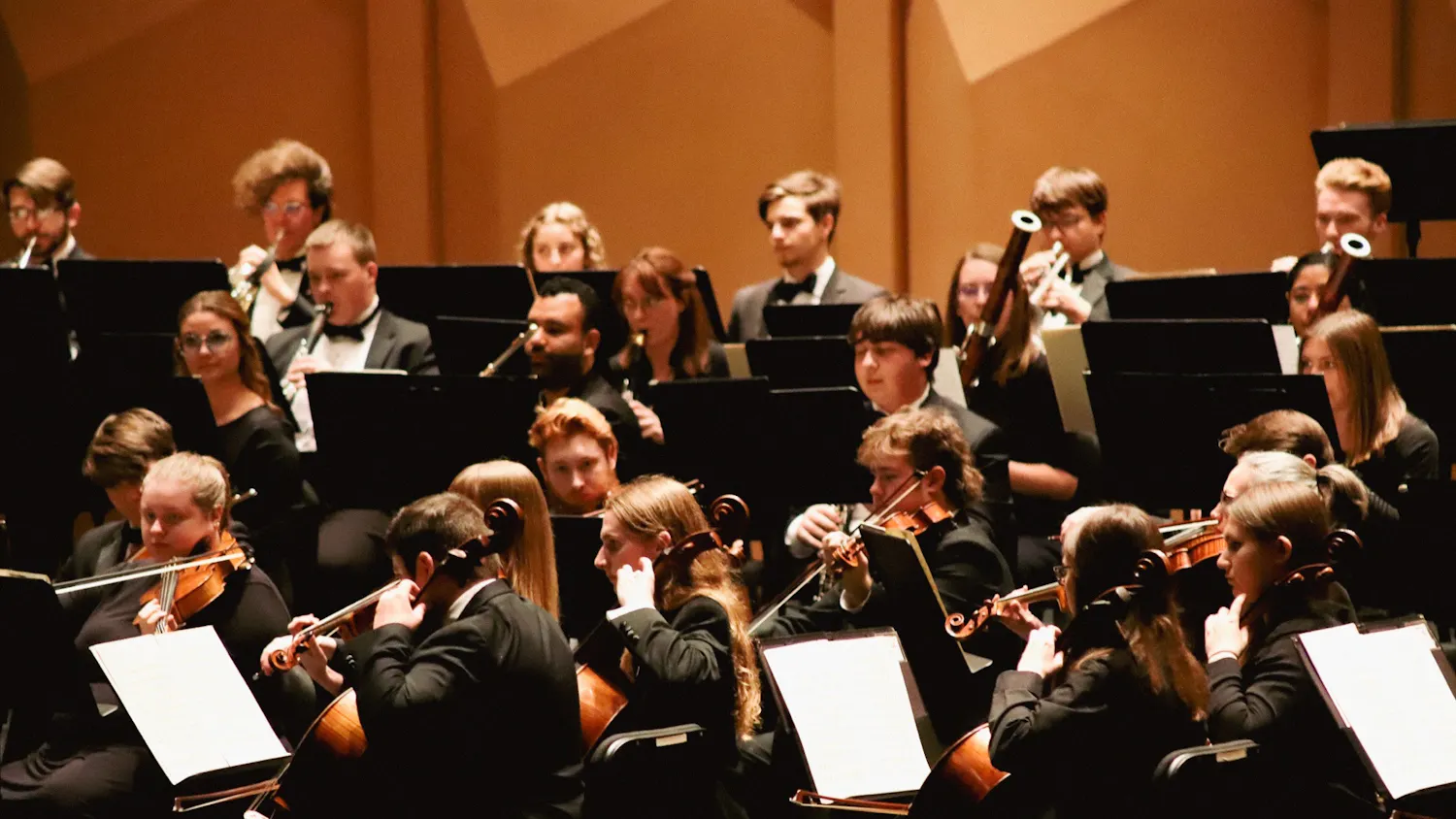 The USC Symphony Orchestra performs its concert “Natasha Paremski Plays Rachmaninov” in the Koger Center for the Arts' Gonzales Hall on Nov. 29, 2022. The program included Johannes Brahms’ "Symphony No. 3" and Sergei Rachmaninov’s "Piano Concerto No. 2." This photo features both string players, primarily cellists and violists, and wind players.