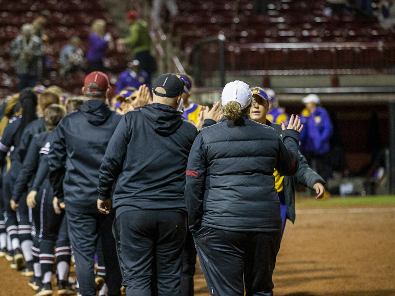 South Carolina and LSU players and coaching staff congratulate each other after their second matchup at Beckham Field on March 13, 2023. The Tigers defeated the Gamecocks 5-1 in the final game, clinching the series win.