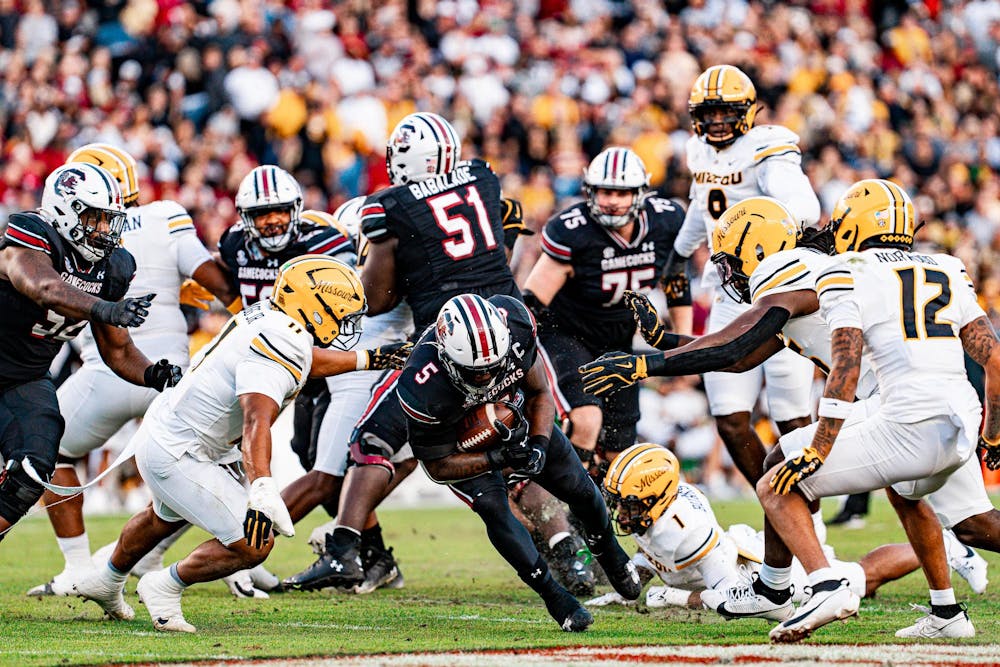 <p>FILE — Fifth-year edge Kyle Kennard tries to rush the ball but gets tackled by a Mizzou defender during the matchup at Williams-Brice Stadium in 2024. The Gamecocks defeated Missouri 34-30 on Nov. 16, 2024.</p>