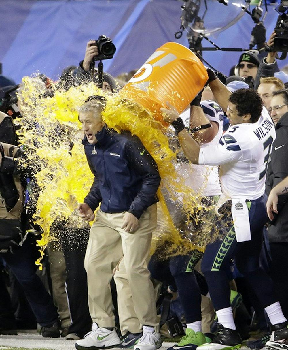 Seattle Seahawks players dump Gatorade on head coach Pete Carroll at the conclusion of a 43-8 win against the Denver Broncos in Super Bowl XLVIII at MetLife Stadium in East Rutherford, N.J., on Sunday, Feb. 2, 2014. (J. Patric Schneider/MCT)