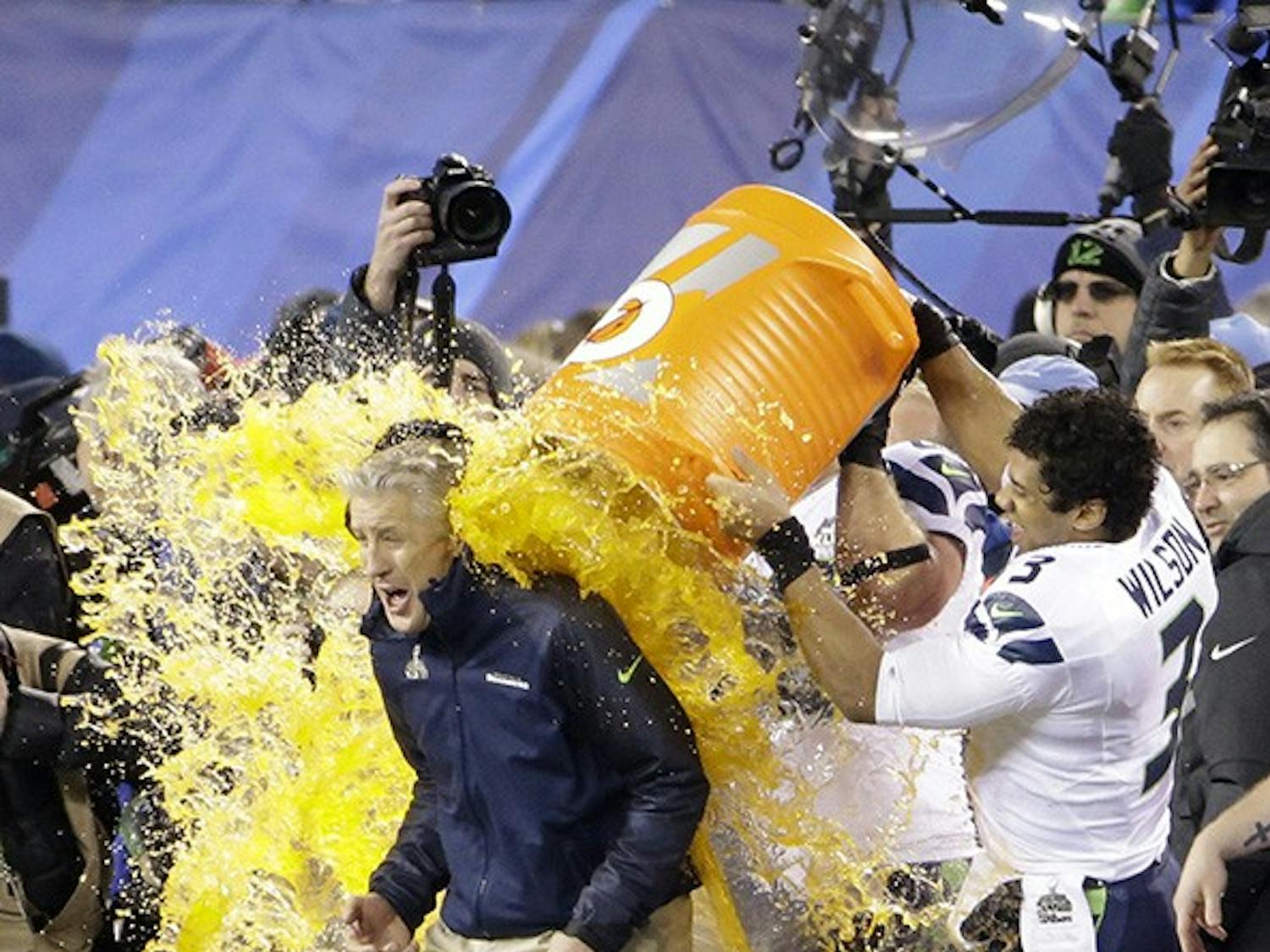 Seattle Seahawks players dump Gatorade on head coach Pete Carroll at the conclusion of a 43-8 win against the Denver Broncos in Super Bowl XLVIII at MetLife Stadium in East Rutherford, N.J., on Sunday, Feb. 2, 2014. (J. Patric Schneider/MCT)