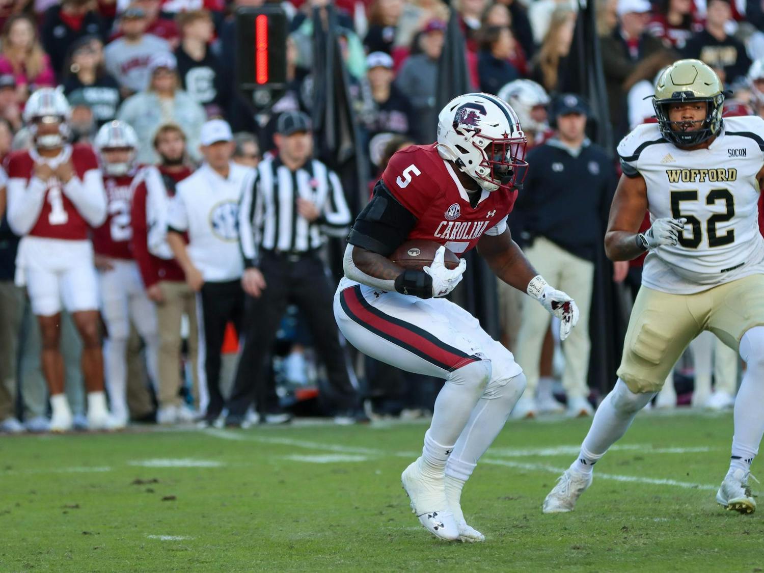Senior running back Raheim Sanders searches for a pocket to run through during the game against Wofford on Nov. 23, 2024. Sanders scored the first touchdown of the game and finished with 72 rushing yards.