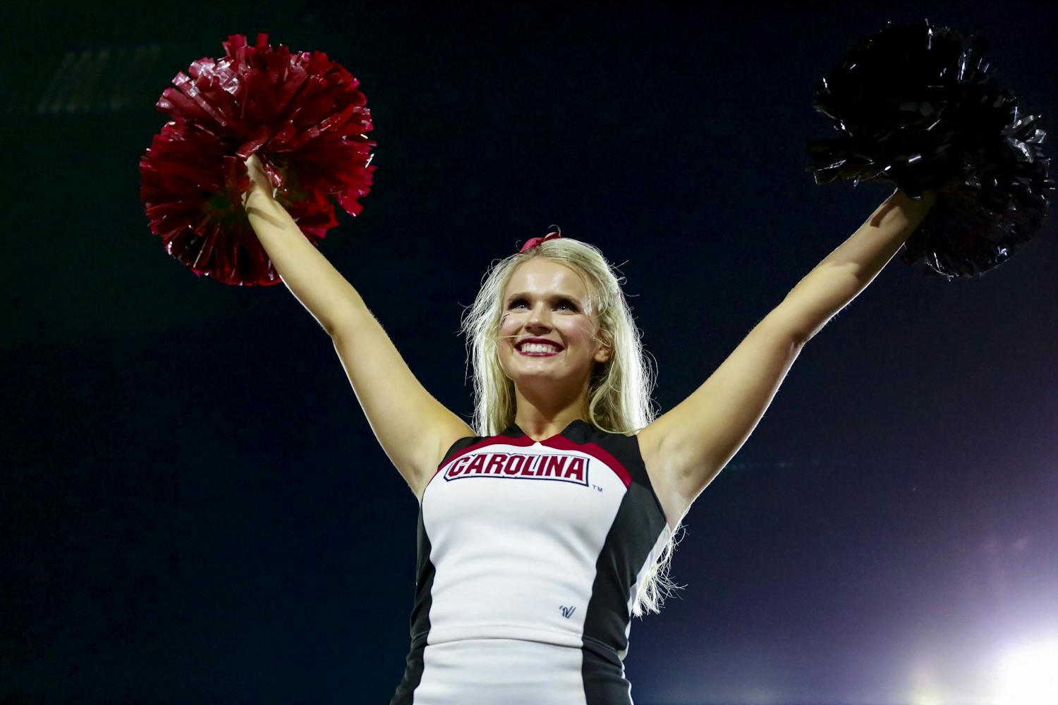A Gamecock cheerleader performs a stunt during South Carolina's game against Georgia on September 18, 2021.