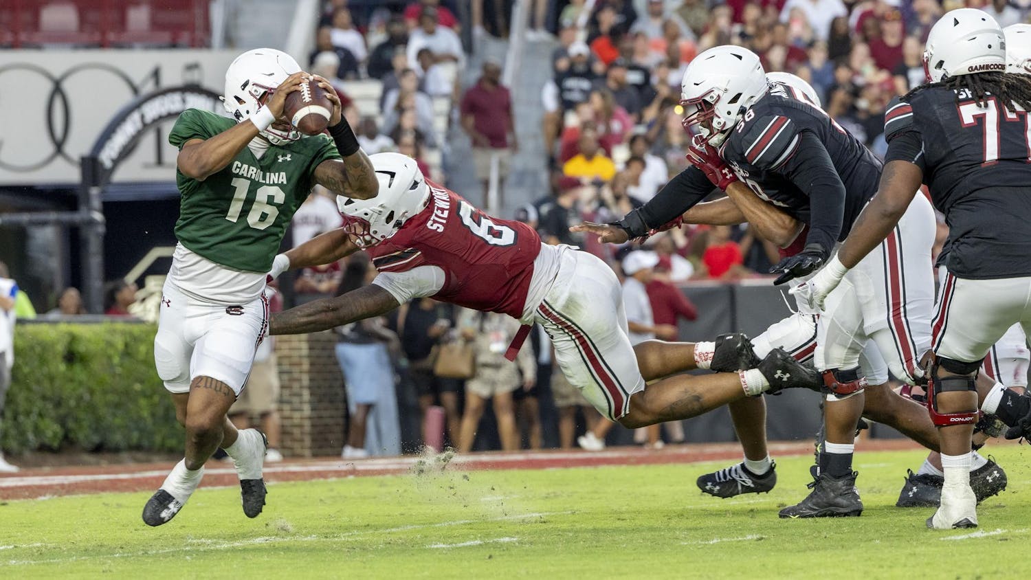Redshirt sophomore LaNorris Sellers dodges a tackle during the 2025 spring game at Williams Brice Stadium on Friday, April 18, 2025. Sellers started at quarterback for Team Black who lost to Team Garnet 10-7.