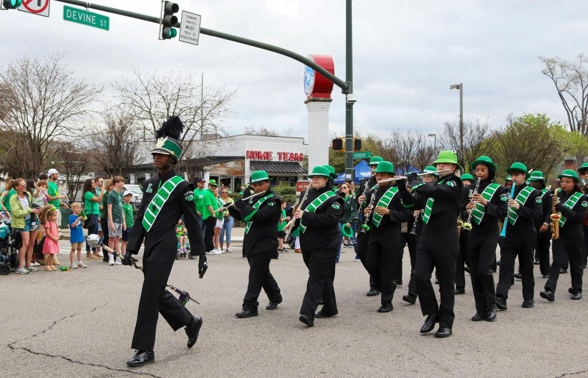 The Lakewood High School marching band walks in the 40th Annual St. Pats in 5 Points Parade. The local high school provided band members for the festival parade to march along floats, dancers, and other performers. 