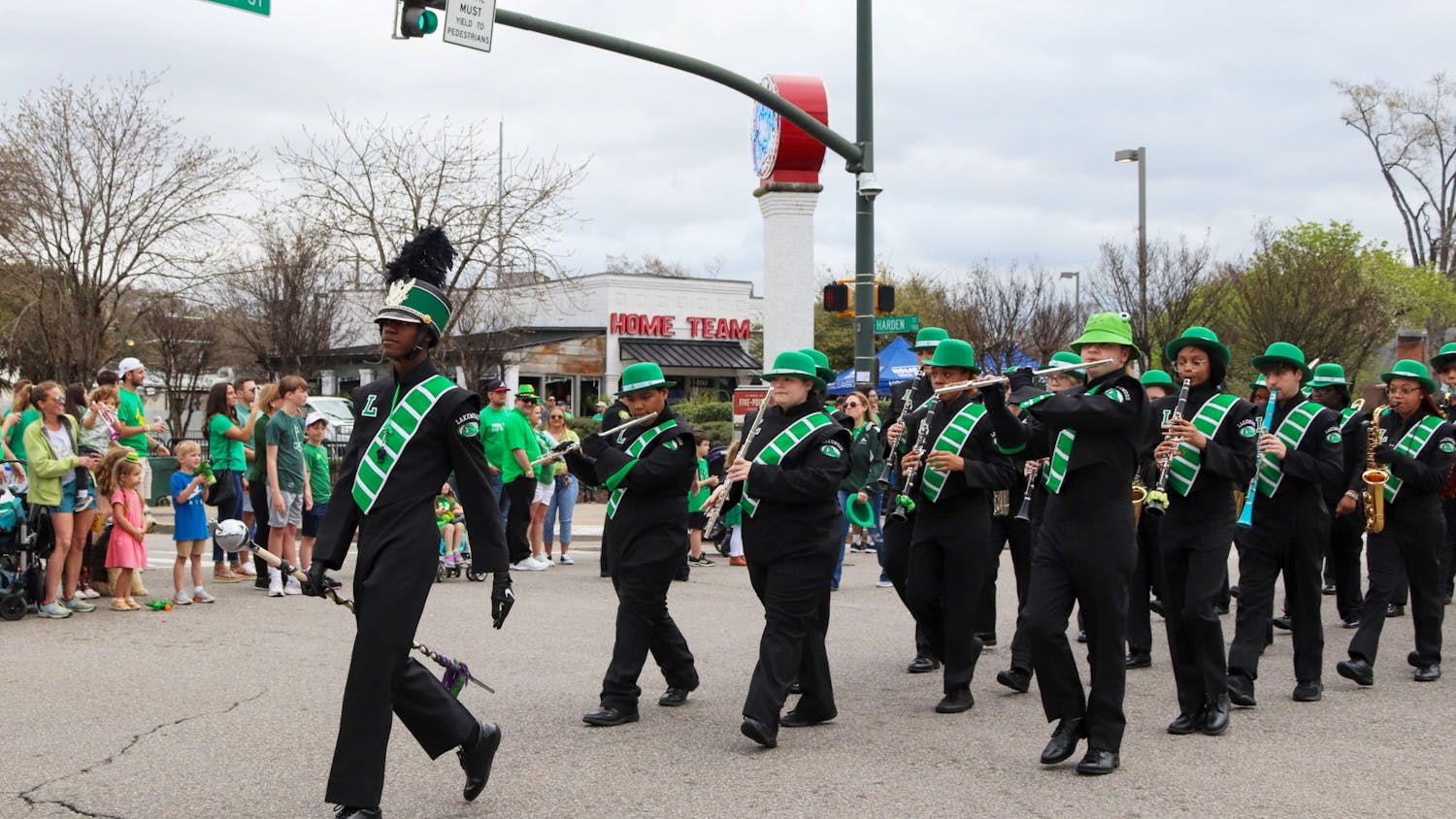 The Lakewood High School marching band walks in the 40th Annual St. Pats in 5 Points Parade. The local high school provided band members for the festival parade to march along floats, dancers, and other performers. 