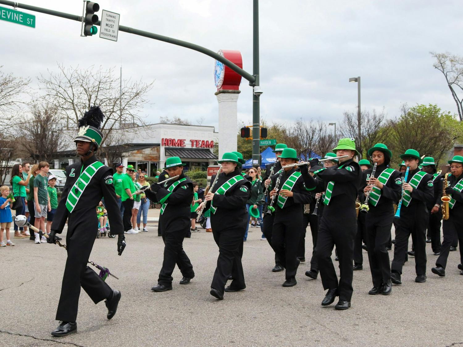 The Lakewood High School marching band walks in the 40th Annual St. Pats in 5 Points Parade. The local high school provided band members for the festival parade to march along floats, dancers, and other performers. 
