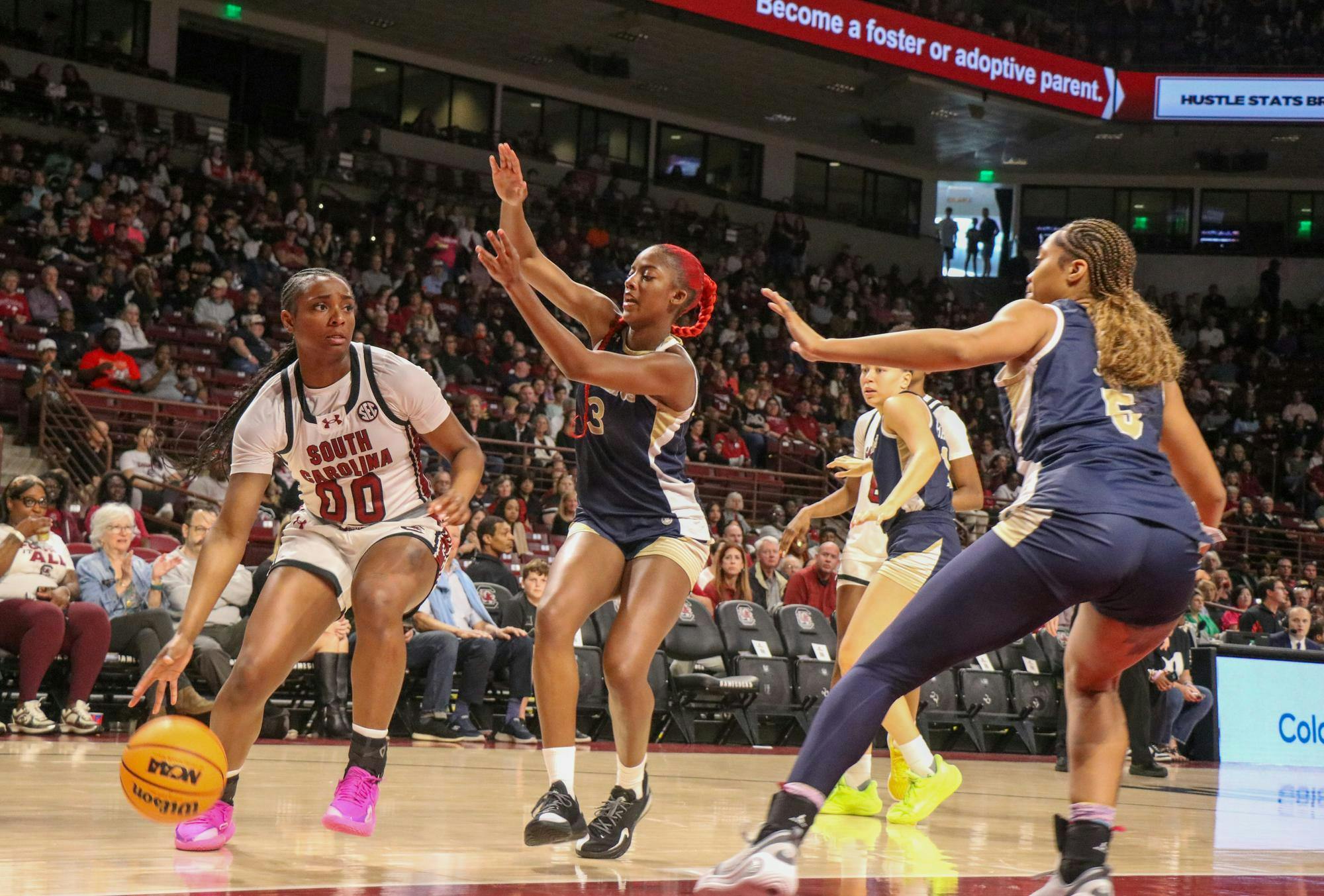 Senior guard Ta'Niya Latson looks for an opening against Queens University of Charlotte players at Colonial Life Arena on Nov. 23, 2025. Latson scored 23 points against the Royals.&nbsp;