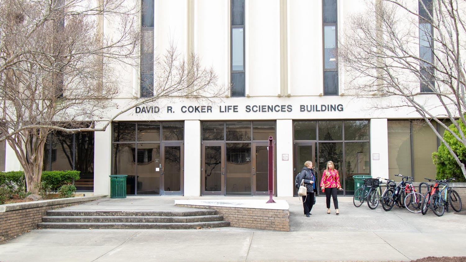 USC faculty members walk outside of the Coker Life Sciences Building on Feb. 22, 2024. The building was built in 1973 and named after USC alumnus and board of trustees member David R. Coker.