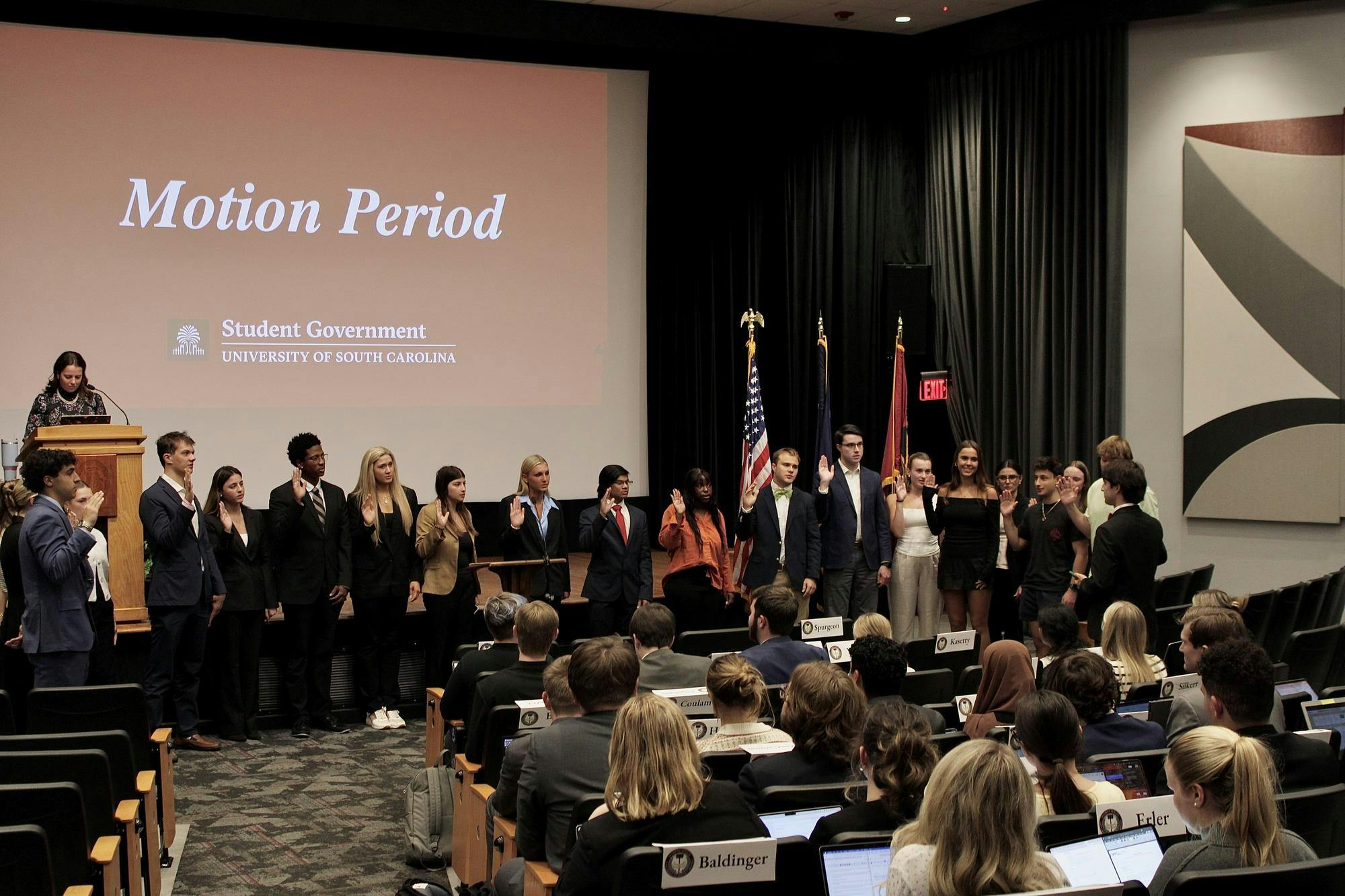 Students repeat an oath of office during the student senate meeting on Oct. 22, 2025 in the Russel House Theater. During the motion period, new members of the Student Government are officially sworn in.