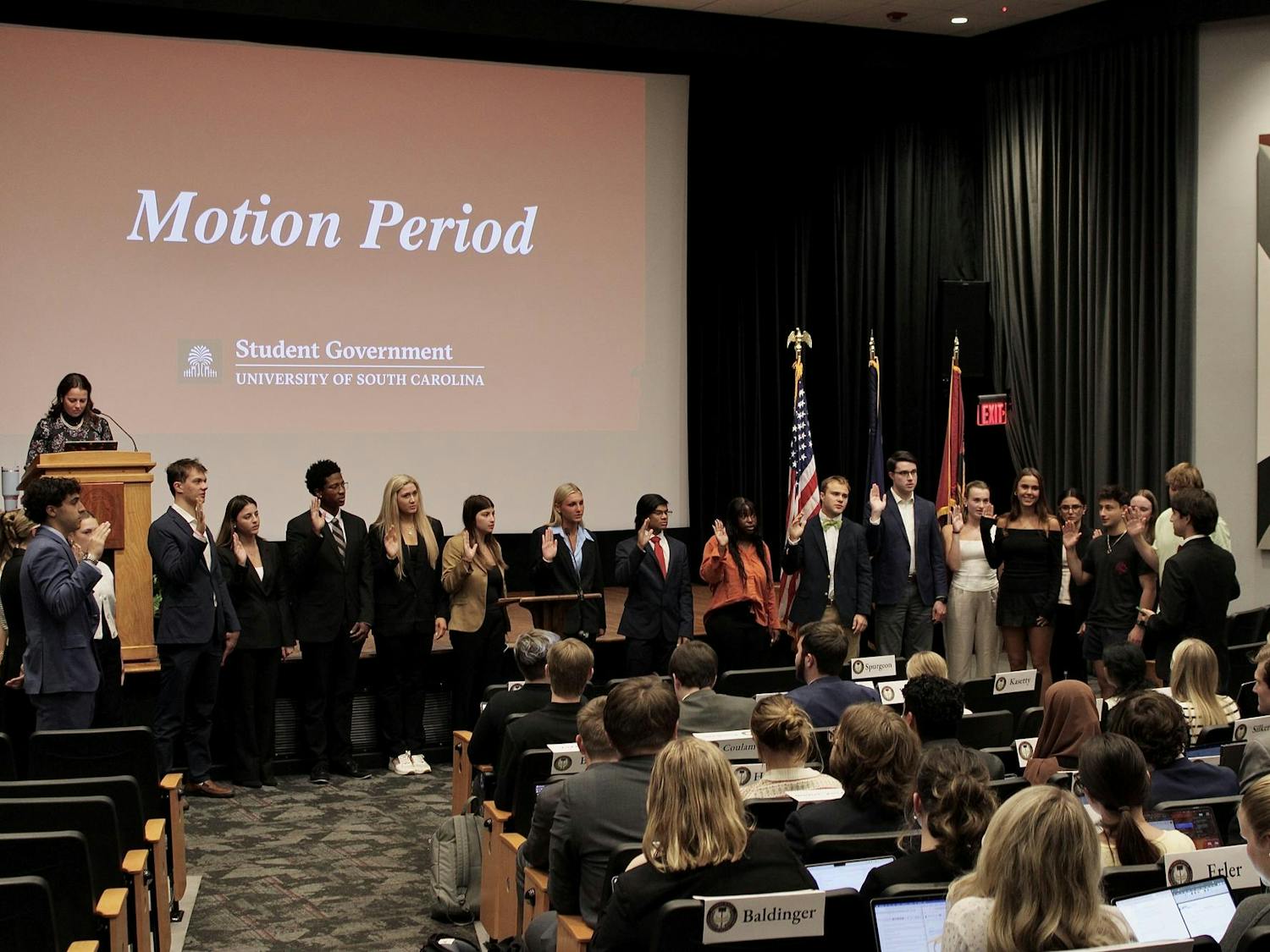 Students repeat an oath of office during the student senate meeting on Oct. 22, 2025 in the Russel House Theater. During the motion period, new members of the Student Government are officially sworn in.