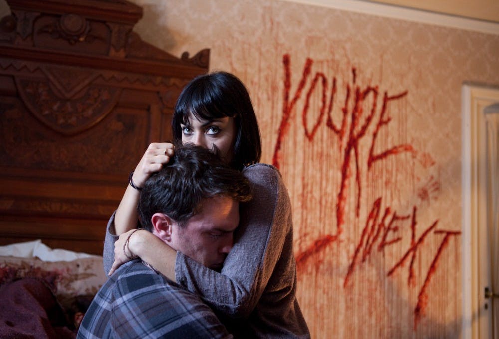 Nick Tucci and Wendy Glenn star in &quot;You&apos;re Next.&quot; (Corey Ransbert/Lionsgate/MCT)
