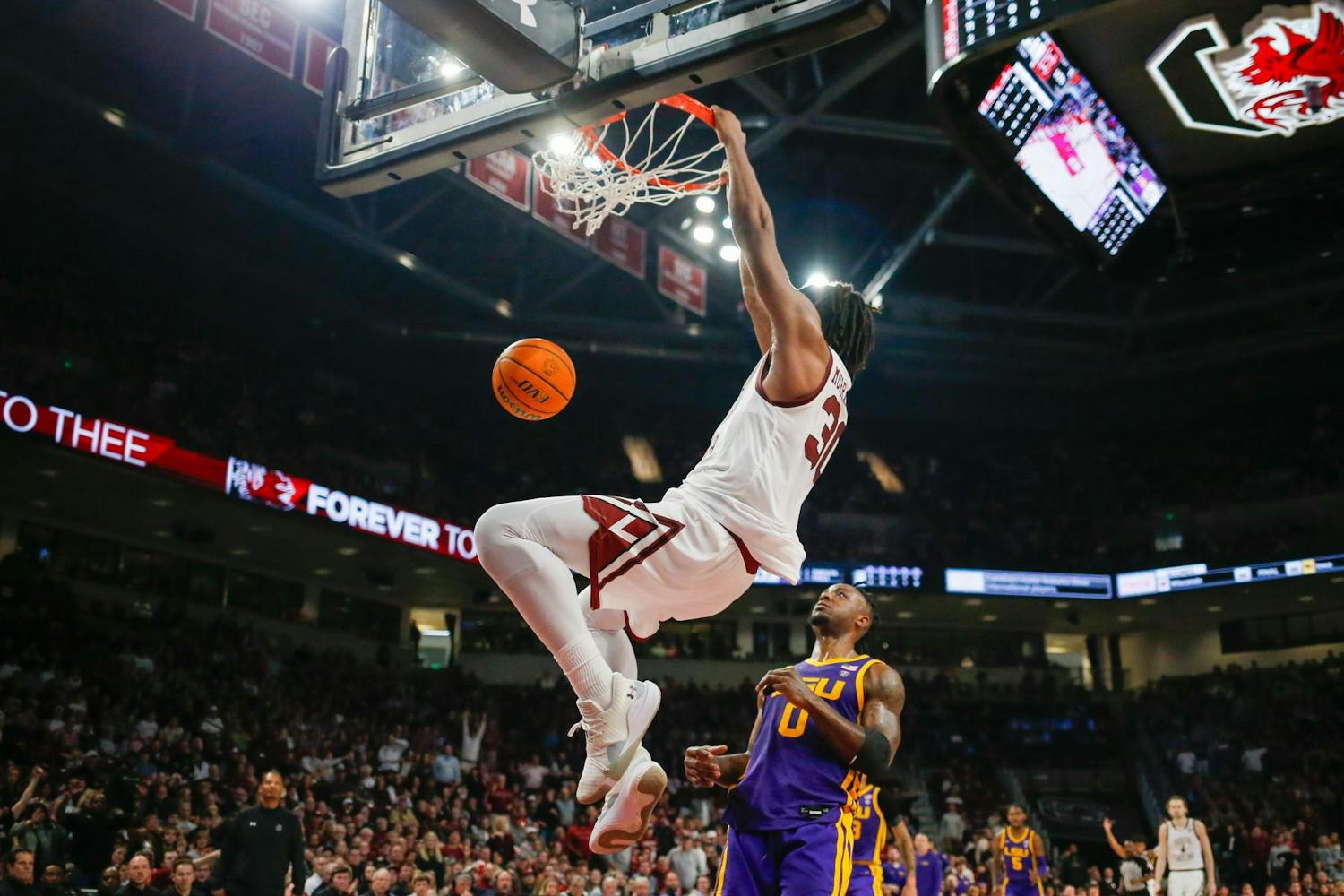 FILE- Freshman forward Collin Murray-Boyles hangs on the rim of the basket during South Carolina’s game against LSU at Colonial Life Arena on Feb. 17, 2024. The Gamecocks defeated the Arkansas Razorback 80-66 in the SEC tournament on March 14, 2024, and Murray-Boyles led scoring with 24 points.