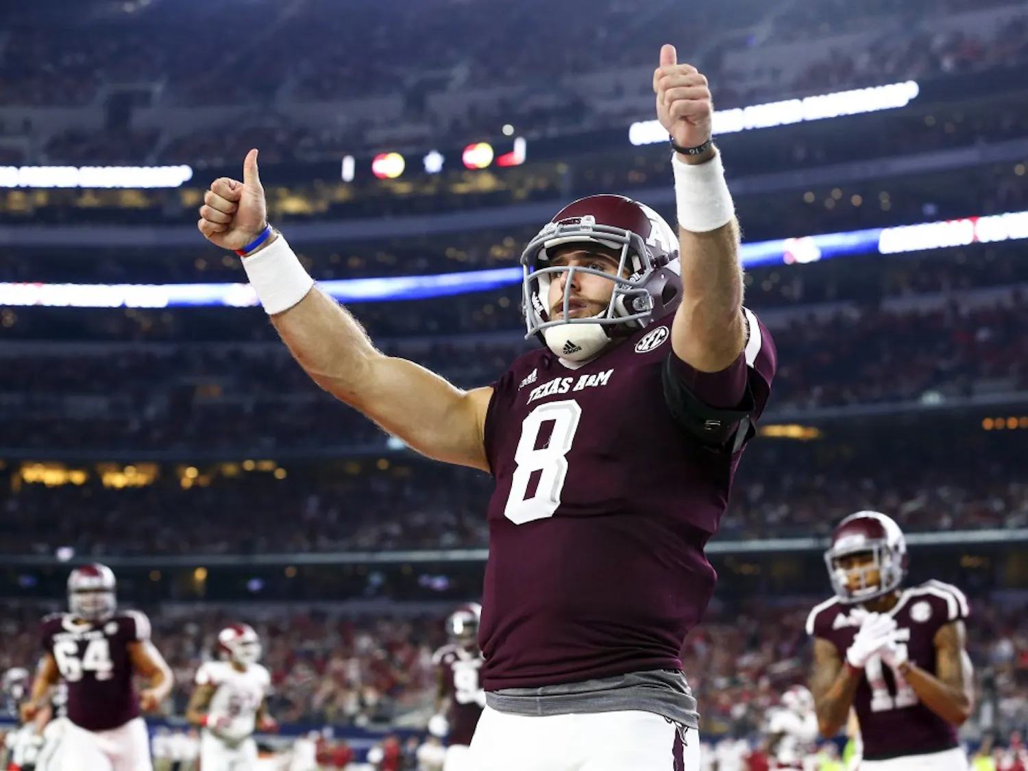 Texas A&M quarterback Trevor Knight (8) celebrates a touchdown against Arkansas in the second quarter at AT&T Stadium in Arlington, Texas, on Saturday, Sept. 24, 2016. (Richard W. Rodriguez/Fort Worth Star-Telegram/TNS)