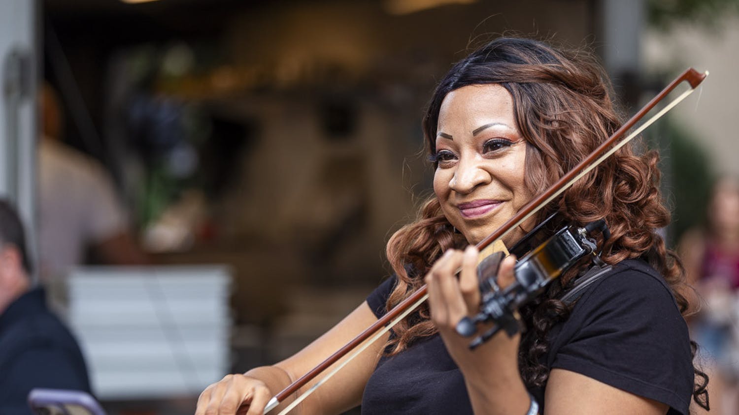 Martina Williams plays the violin at Soda City Market on Sept. 23, 2023. Williams has played music professionally for two-and-a-half years and credits busking for helping her turn her passion for music into an occupation.
