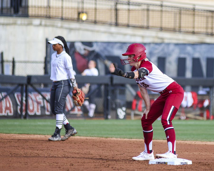 Junior infielder Riley Blampied signals to her teammates during the match against Western Kentucky University at Beckham Field on Feb.19, 2023. The Gamecocks defeated the Hilltoppers 11-2.&nbsp;