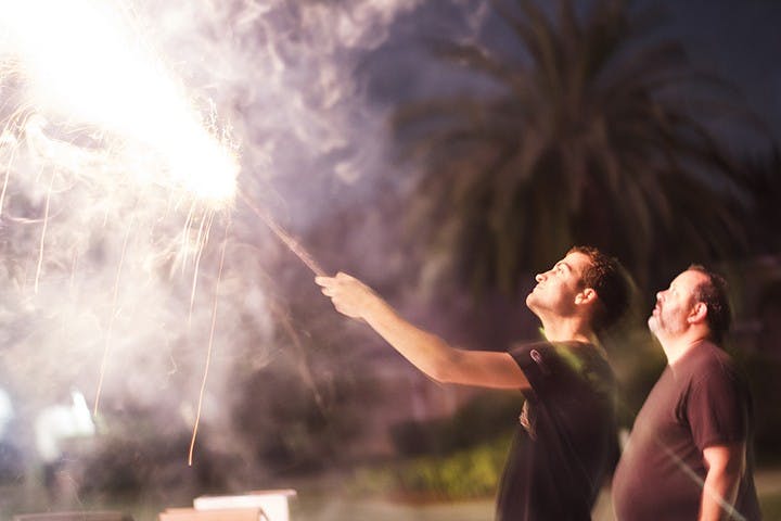 Shooting off roman candles, a type of firework, on New Year's Eve
